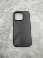 matte black protective smartphone cases resting on a soft, plush white faux-fur surface