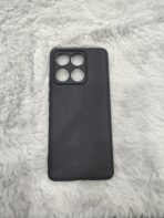 matte black protective smartphone cases resting on a soft, plush white faux-fur surface - Image 2