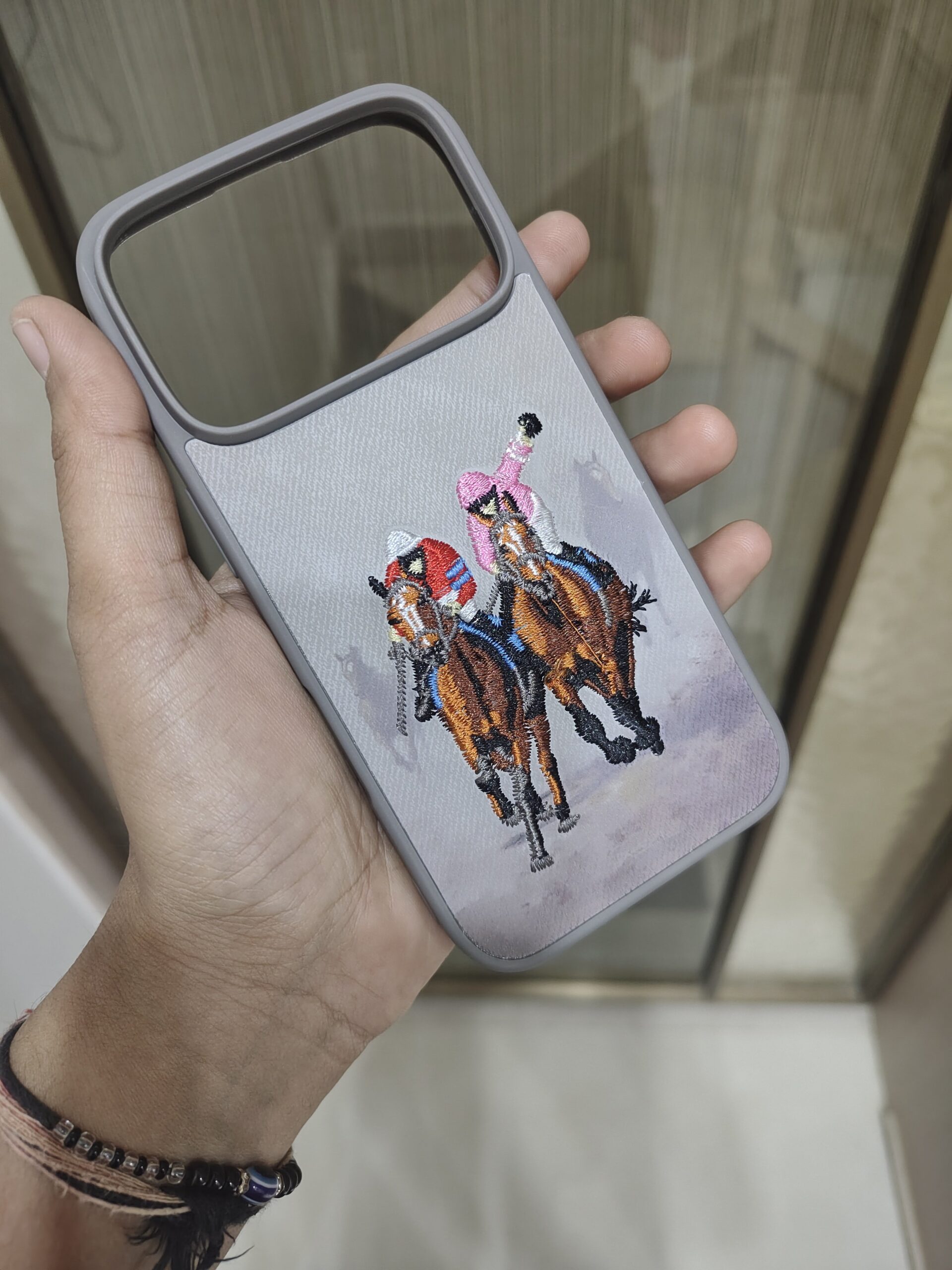 2026/09/1417-scaled.jpg Embroidered Cowboy Horse Rider Phone Case - Image 1
