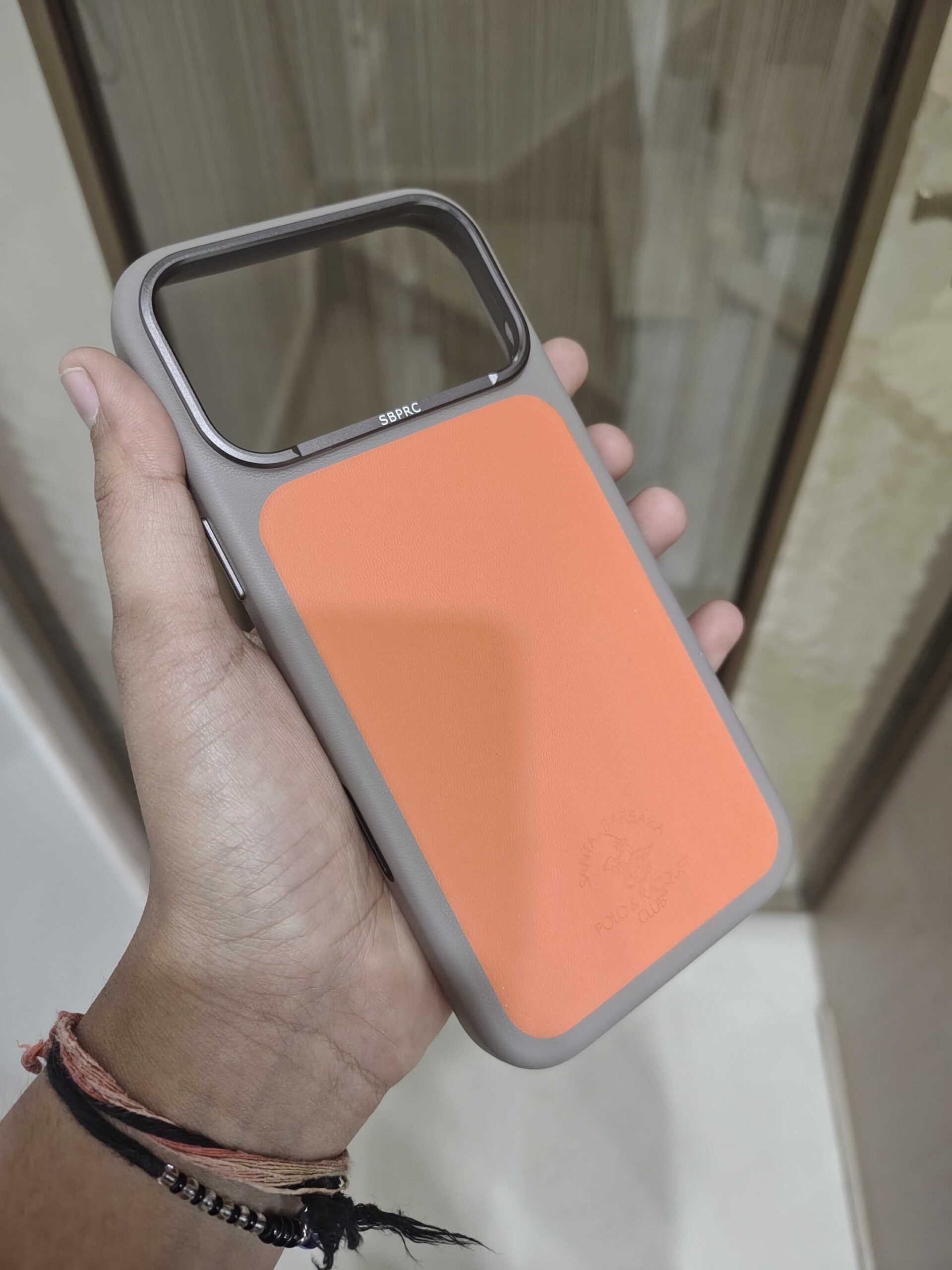 2026/09/1837-1-scaled.jpg Santa Barbara Polo & Racquet Club Premium Leather Finish Phone Case – Orange - Image 1