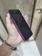 dbrand Grip Case paired with a textured magenta/purple carbon fiber checkerboard skin - Image 4